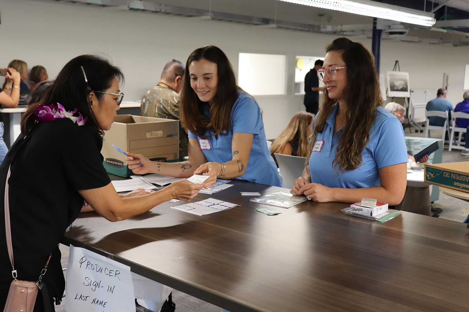 Producers checking in at the Farm to School Market Briefing & Gathering connecting local food suppliers with Hawaiʻi school meal programs