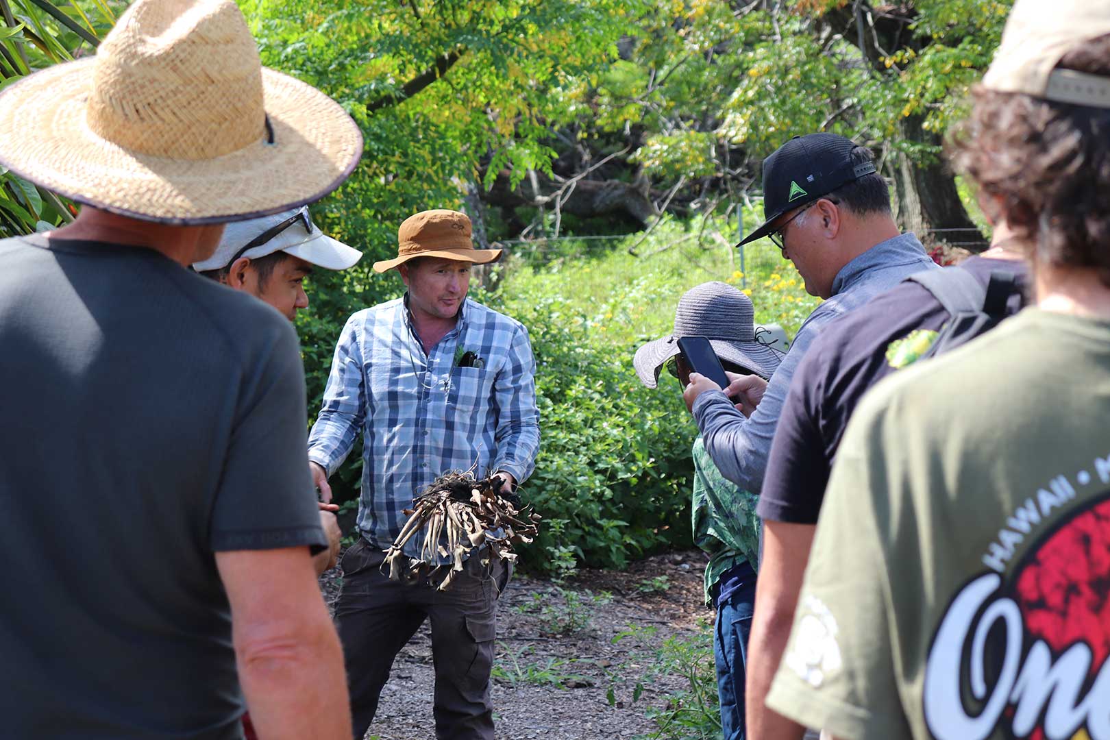 Attendees observe an outdoor farm food safety demonstration at the Maui Food Safety Summit held May 2026, hosted through North Shore EVP’s partnership with the UHM-CTAHR Farm Food Safety Program.